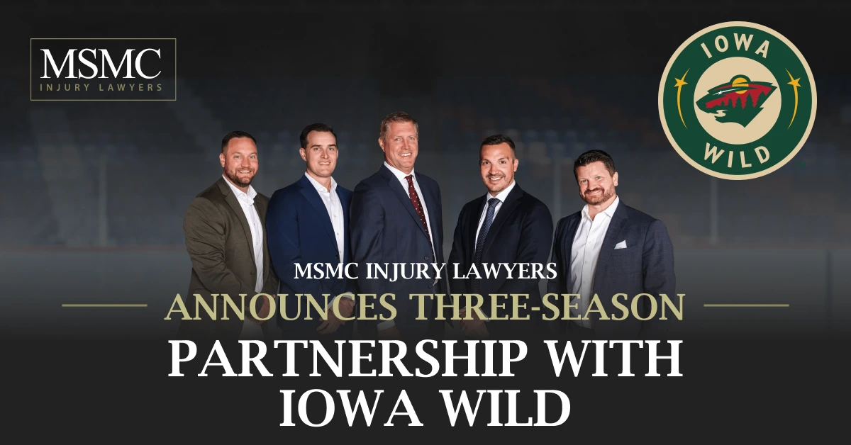 Group of five men in suits standing together, MSMC Injury Lawyers announce partnership with Iowa Wild.